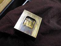  Scratches on the valve face.  Not sure why there is a stain on one end. ?Burned oil?